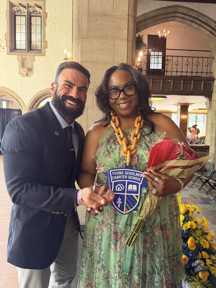Matthew Laken receiving the 2026 Community Partner of the Year award from Young Scholars Charter School